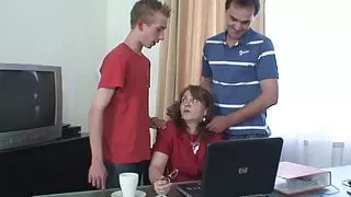 Hairy granny swallows two cocks at once in the office
