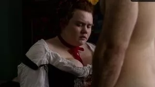 Whore giving a fit guy a handjob