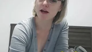 Perky little blonde with glasses.