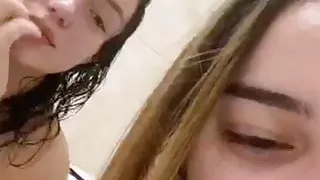 Two girls in bat, one show nipslip