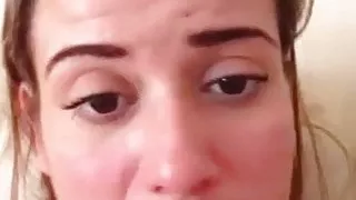 Playing with her own massive tits