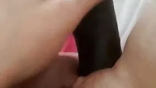 My slut plays with black dildo