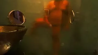 A brown man in a fancy glass and marble shower.