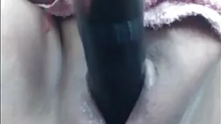 Woman masturbating with dildo