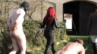 Riding Mistress trains ponyboys horsewhip