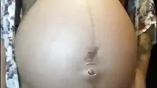 Pregnant woman showing her body