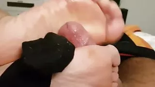 Cumming on her lovely legs during a skilled footjob