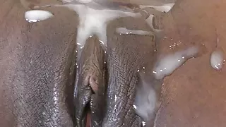 Chocolate pussy covered with thick cum