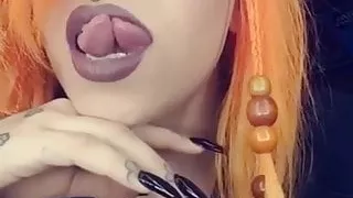 Sexy babe shows off her split tongue