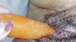 Fucking. My pussy with a carrot mmm