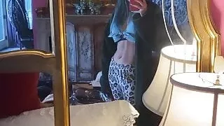 Bella Thorne admiring her abs in a mirror