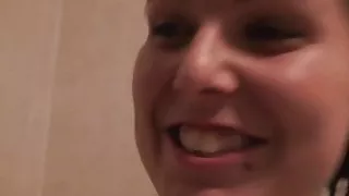 Horny babe displays her goods in the shower