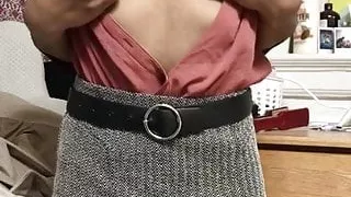 Pinching her nipples