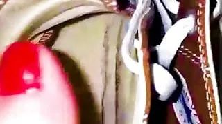 Girl shows her sweaty, stinky Converse sneaker shoes