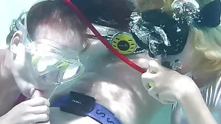 Two hot girls blow big cock in the pool