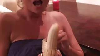 Busty babe uses a banana on her slit