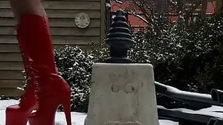 Very High Red Heels In Snow Riding Huge Ribbled Pyramide