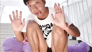 Chinese Boy moaning cums in hand and eating it