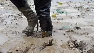 Two thai in thigh boots swim in mud!!!