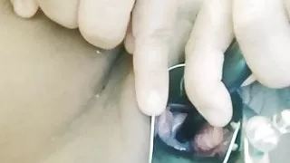 Thai milf inserts tube deep in her cervix