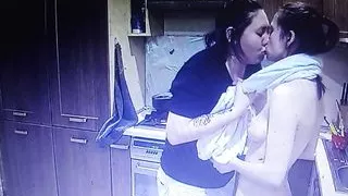 Two young lesbian girls kiss and have sex together