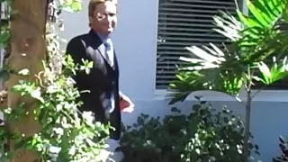 Businessman in a classy suit gets blowjob from gay buff dude