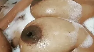 Playing with my sexy big boobs in the bath tub