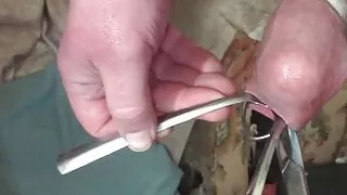 Foreskin with a table tennis ball, scissors, two spoons