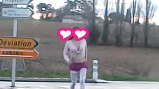 schoolgirl flashing on traffic circle roadsigns plugged