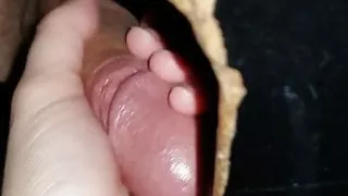 Wife jerking stranger cock through the gloryhole