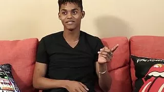 Black young man gives an interview and stimulates himself
