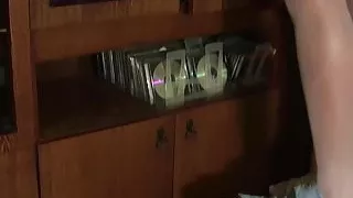 The maid folds clothes and linen and a wardrobe.