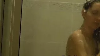Voyeur spying zooming in on amateur in shower washing hair