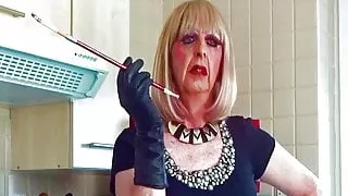 Glamorous Granny tranny Mandy smoking with sexy holder