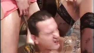 Two girls piss on man face