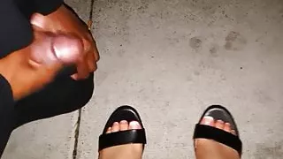 Black pervert cumming on sexy feet in black sandal in public