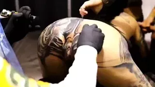 Crazy tattoo slut gets her butt hole tatted and suck 2 guys