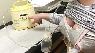 Pumping milk from tits in nursing bra