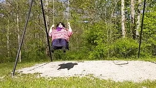 Molly swinging in the park in her beautiful sexy outfit