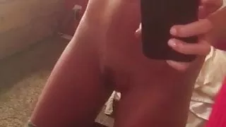 Perfect blonde model nude selfie in mirror