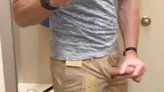 Wanking in the clothing store public fitting room