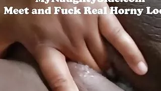 Chocolate doll fingering her creamy pussy