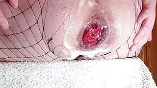 Extreme anal fisting while sitting in a chair