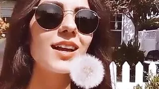Victoria Justice with a dandelion