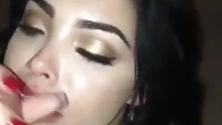 Latina dark haired babe sucks big one