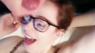 Happy girl redhead with glasses facial