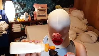 Feeding the Baby his milkshake