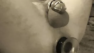 Hubby stretching arse with big buttplug