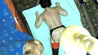 Flogging wax of her bare back