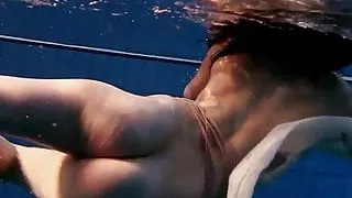 Dark haired teen Andrea in the pool